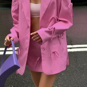 Рожевий піджак із бантом